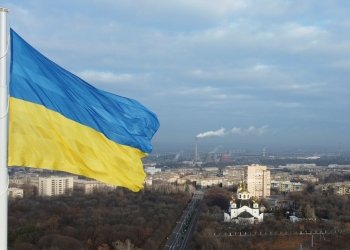 FILE PHOTO: The national flag of Ukraine flies over the town of Kramatorsk, Ukraine November 25, 2021. REUTERS/Valentyn Ogirenko