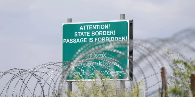 epa04846467 Barded wire of the border between the Georgian breakaway region of South Ossetia and Georgia in the village of Khurvaleti, some 60 kms from Tbilisi, Georgia, 14 July 2015. According to media reports, protesters came out in protest against what they called 'creeping annexation' after Russia border guards allegedly altered border markings, encroaching on Georgian territory.  EPA/ZURAB KURTSIKIDZE