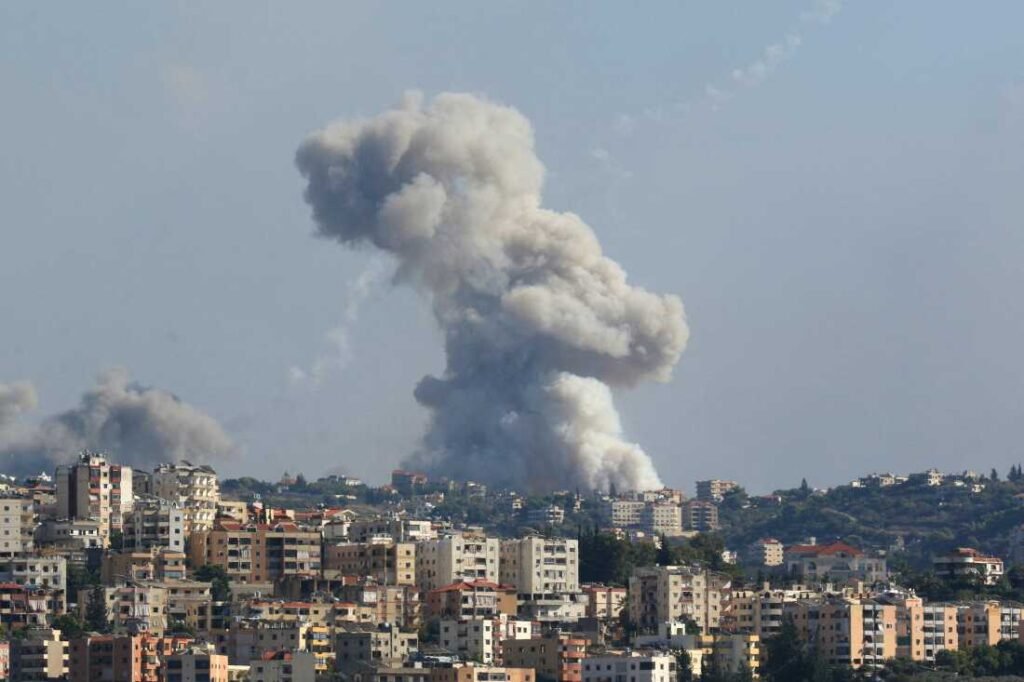 TOPSHOT - Smoke billows from a site targeted by Israeli shelling in the southern Lebanese village of Zaita on September 23, 2024. The Israeli military on September 23 told people in Lebanon to move away from Hezbollah targets and vowed to carry out more "extensive and precise" strikes against the Iran-backed group. (Photo by Mahmoud ZAYYAT / AFP) (Photo by MAHMOUD ZAYYAT/AFP via Getty Images)